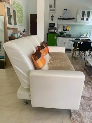 a white couch sitting in a living room at Villa du Bonheur Mer et Nature Rawai beach in Phuket Town