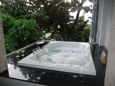 a bath tub sitting on top of a table at Villa Ginborn 5 bedroom Pool Villa with Sea View in Kata Beach in Kata Beach