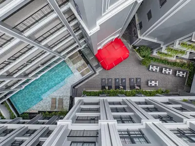 an overhead view of a building with a pool at Chateau Du Village Patong in Patong Beach