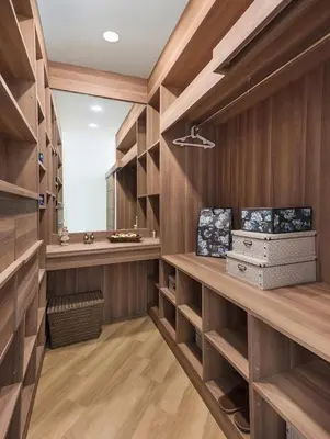 a wine cellar with wooden walls and wooden shelves at Appartements avec piscine in Rawai Beach