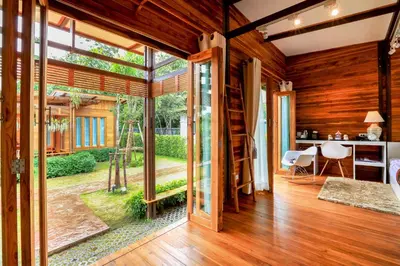 an open living room with a view of a garden at Viangviman Luxury Resort, Krabi in Ao Nang Beach