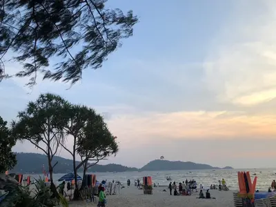 a group of people on a beach near the water at Cozy Patong studio apartment in Patong Beach