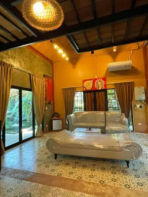 a bedroom with a large bed in a room at Baibon1 Boutique House Thalang Phuket in Ban Na Nai