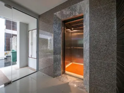 a walk in shower with a glass door at Naithon Beachfront Condotel in Nai Thon Beach