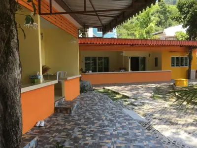 an outside view of a house with a patio at Kathu Waterfall Bungalow Holyday home in Ban Huai Luk (1)