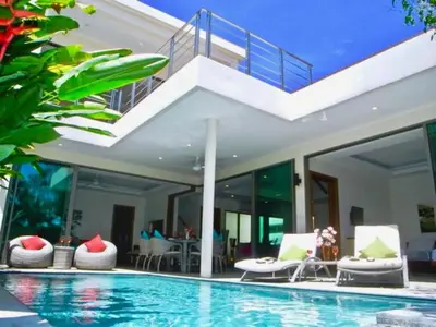 a villa with a swimming pool and a house at Rawai Beach Private Pool Villa -3 Bedrooms in Rawai Beach