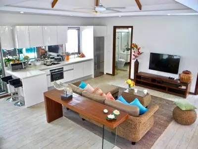 a living room with a couch and a table at Rawai Beach Private Pool Villa -3 Bedrooms in Rawai Beach