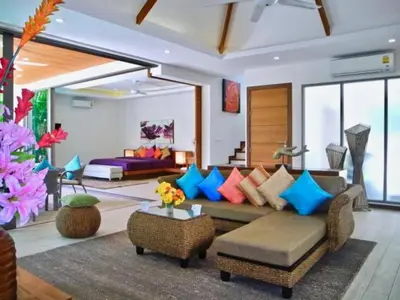a living room with a couch and a bed at Rawai Beach Private Pool Villa -3 Bedrooms in Rawai Beach