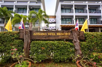 a sign in front of a building with flags at Aonang Viva Resort - SHA Plus in Ao Nang Beach