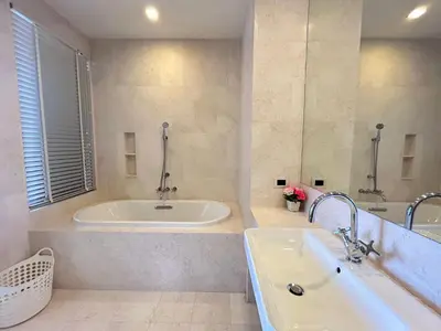 a large bathroom with a tub and a sink at 2 Bedroom Beachfront Apartment With Sea Views in Mai Khao Beach
