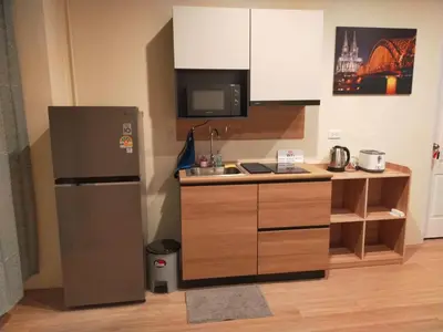 a kitchen with a refrigerator and a sink at Bonanza Patong Beach1 100m to Beach Star Room in Patong Beach