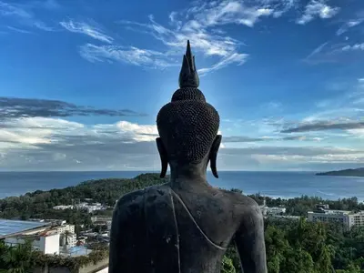 a statue of a woman looking out at the ocean at Villa Amonteera in Surin Beach