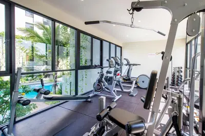 a gym with treadmills and elliptical machines at 1 Bedroom Pool view at Diamond Condo, Bangtao in Bang Tao Beach