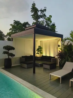 a pavilion with couches and a pool on a building at Bangtao Luxury Pool Villa - Prymana in Phuket Town