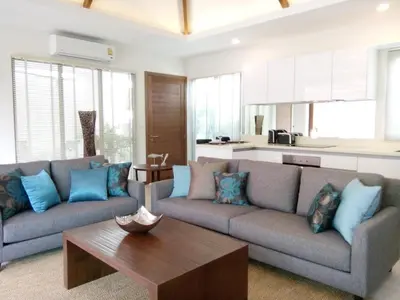 a living room with two couches and a coffee table at 4 Bedrooms Private Pool Villa near Rawai Beach in Rawai Beach