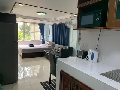 a kitchen and living room with a couch and a bed at Apartment in Rawai in Rawai Beach