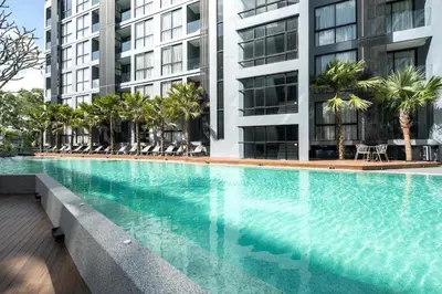 a large swimming pool in front of a building at Tropics Kamala Hill View Suite CTG D707, near Beach and Fantasea in Kamala Beach
