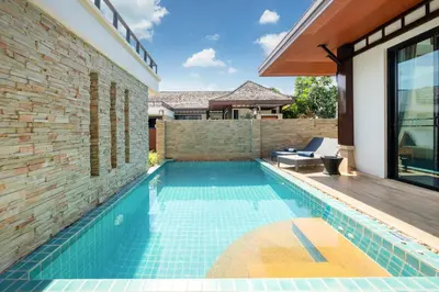 a swimming pool in the backyard of a house at Private 2BR Pool Villa 2D03 in Gated Residence Rawai VIP Villas in Rawai Beach