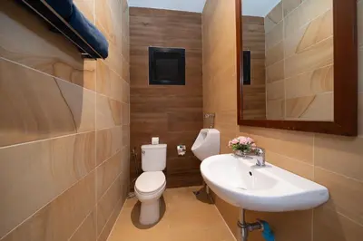 a bathroom with a toilet and a sink at Private 2BR Pool Villa 2D15 in Gated Residences Rawai VIP Villas near Kids Park in Rawai Beach