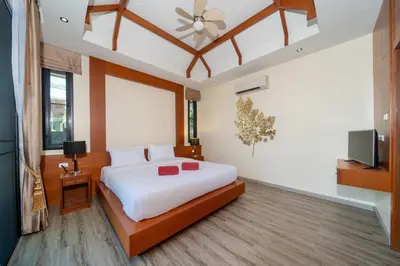 a bedroom with a bed and a ceiling fan at Private 2BR Pool Villa 2D15 in Gated Residences Rawai VIP Villas near Kids Park in Rawai Beach