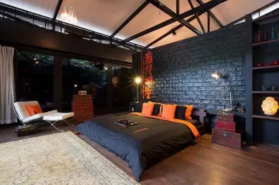 a bedroom with a large bed and a brick wall at 05 - Exquisite Paradise Retreat in Nai Thon Beach
