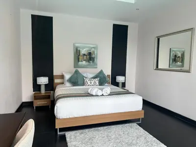 a bedroom with a bed with two towels on it at Pool Villa - 3 Bedroom- Walking to Bangtao Beach, Restaurants and Supermarkets in Bang Tao Beach