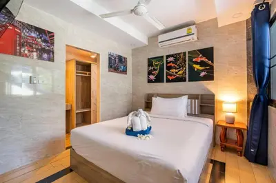 a bedroom with a large white bed in a room at 4-5 bedroom Villa At Kamala Beach, Pool in Kamala Beach