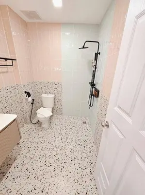 a bathroom with a toilet and a shower at Baan 112 Patong in Patong Beach