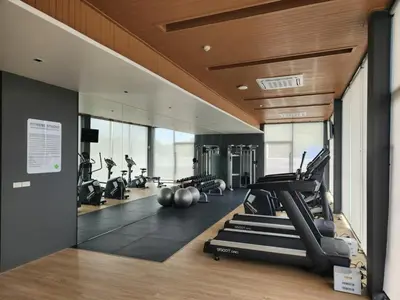 a gym with treadmills and elliptical machines at WEG NaiThon Beach in Nai Thon Beach