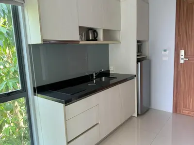 a kitchen with a sink and a counter top at At the Tree bright studio by Lofty in Rawai Beach