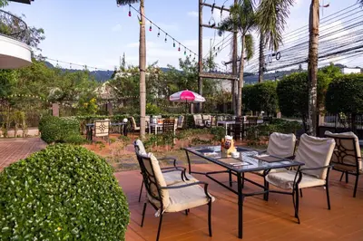 a patio with a table and chairs on a patio at Mipiace in Kamala Beach