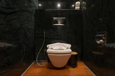 a bathroom with a toilet with a hose at Do You Want Luxury Sea views With Beach Access V38 in Rawai Beach