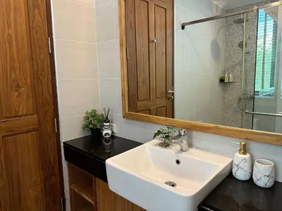 a bathroom with a sink and a mirror at 208 Ao Nang, Private Sea View Pool Villa in Krabi town