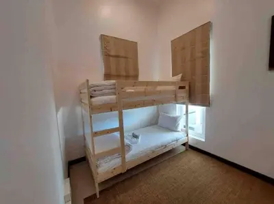 a bunk bed with a ladder in a room at Luxurious 5 bedroom 5 bathroom Gym Views v138 in Kamala Beach
