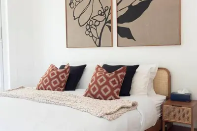 a bedroom with a white bed with pillows on it at Luxurious 5 bedroom 5 bathroom Gym Views v138 in Kamala Beach