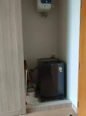 a small television sitting in a corner of a room at Condo 1 bed in Phuket City Center 8th Floor in Ban Rangeng