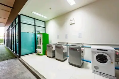 a row of washers and dryers in a building at Condo 1 bed in Phuket City Center 8th Floor in Ban Rangeng