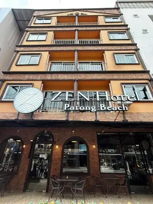 a building with a sign on the front of it at ZEN Hotel Patong Beach -ex- miami Production in Patong Beach