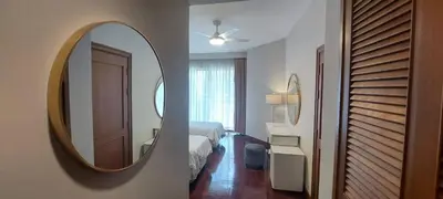 a bedroom with a mirror and a bedroom with a bed at Allamanda Laguna 2 BR c выходом к бассейну in Phuket Town