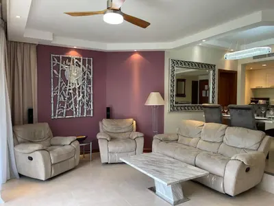 a living room with a couch and chairs and a table at Allamanda Laguna 2 BR c выходом к бассейну in Phuket Town