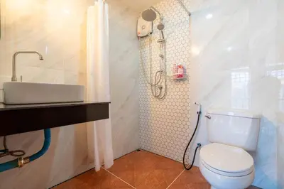 a bathroom with a toilet and a shower and a sink at Cozy Villa 4 Bedrooms Patong,7mins. walk beach/10mns.Bangla Rd in Patong Beach