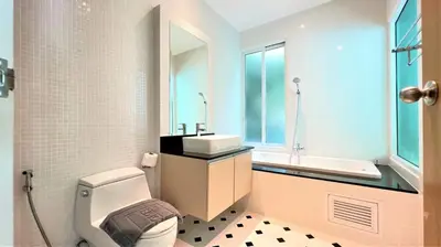 a bathroom with a toilet and a sink at Kamala Falls Seaview 2 bedroom in Kamala Beach
