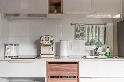 a kitchen with a sink and a counter top at Title V Lemon Fresh Pool View Gym Hammam in Rawai Beach