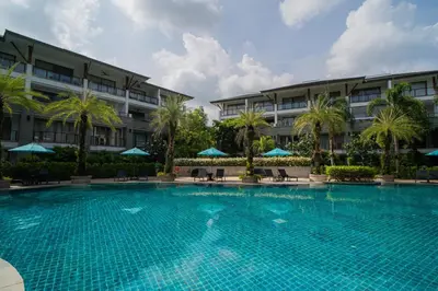 a large swimming pool in front of a building at Modern Beachfront Apartment Naithon Beach in Nai Thon Beach