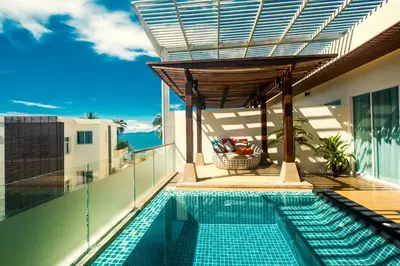 a swimming pool on the balcony of a house at Krabi Luxury Penthouse in Klong Muang Beach