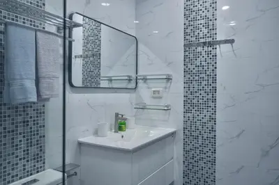 a white bathroom with a sink and a mirror at GORGEOUS NEW DESIGNED 4br KataBeach sweetHome in Kata Beach