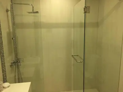 a shower with a glass door in a bathroom at C260 Beach And Town, Modern Big Apartment in Phuket Town