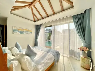 a bedroom with a large bed and a large window at 3 Bed Bang Tao pool villa at The Lux in Phuket Town