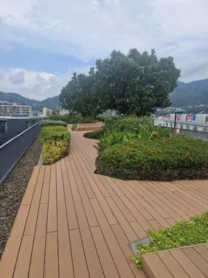 a walkway on the roof of a building at The Deck Condo Patong 5Fl Pool View in Patong Beach