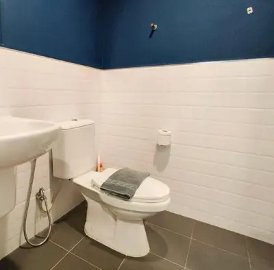 a bathroom with a white toilet and a sink at THE BASE CENTRAL Phuket Shopping Mall Central Floresta in Ban Rangeng